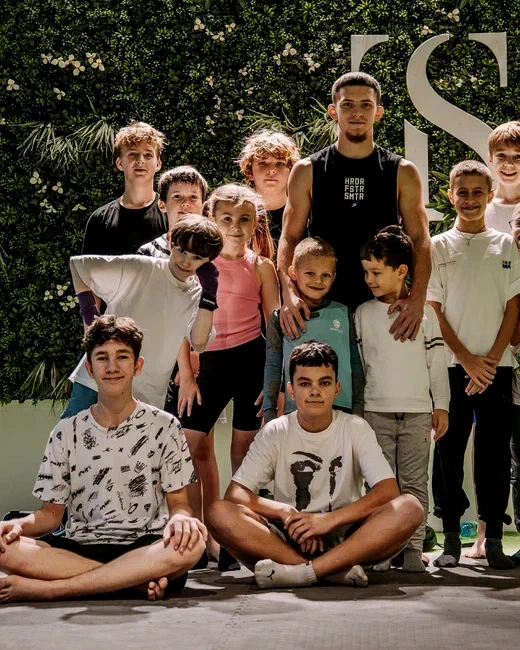 Viacheslav Lenskyi with a children's group after a martial arts session