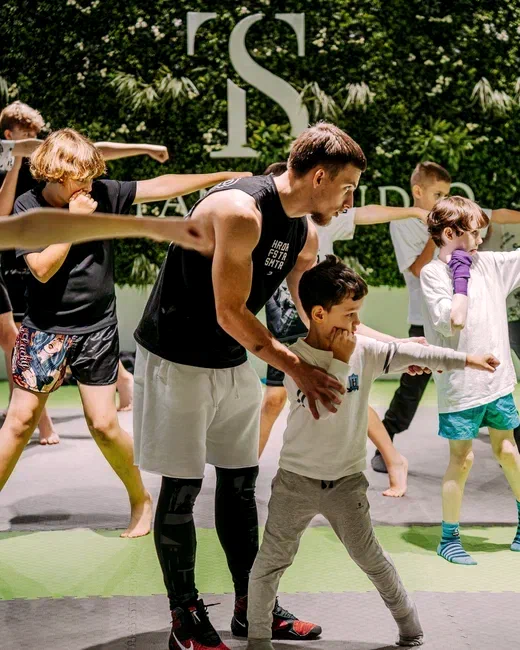 Viacheslav Lenskyi leading a group boxing session for children